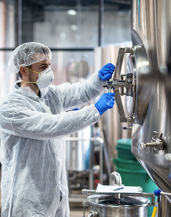 //www.genger.co.za/wp-content/uploads/2021/08/technologist-protective-uniform-wearing-hairnet-mask-goggles-gloves-closing-industrial-tank-reservoir3.jpg